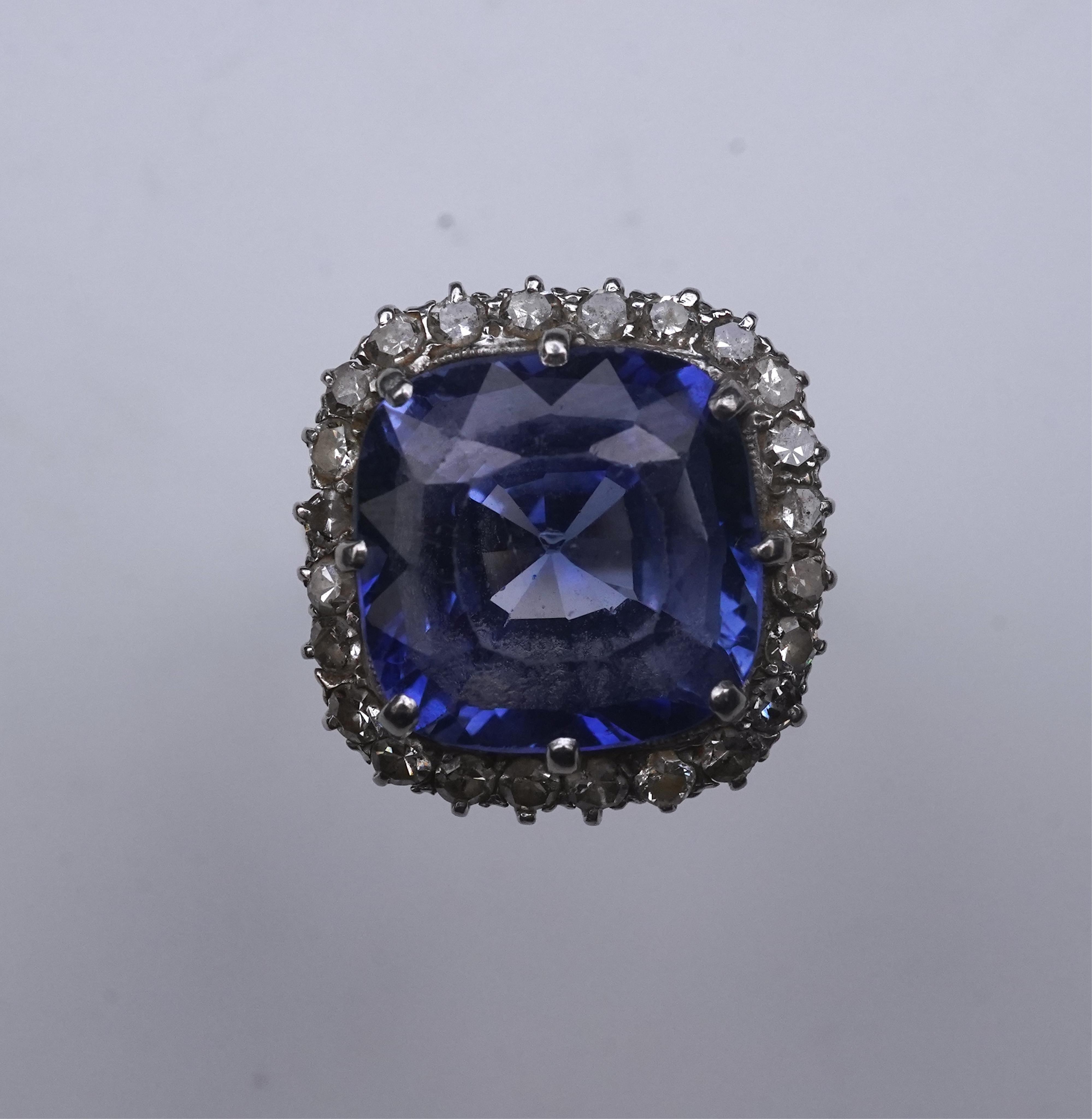 A synthetic sapphire and diamond cluster ring, early 20th century